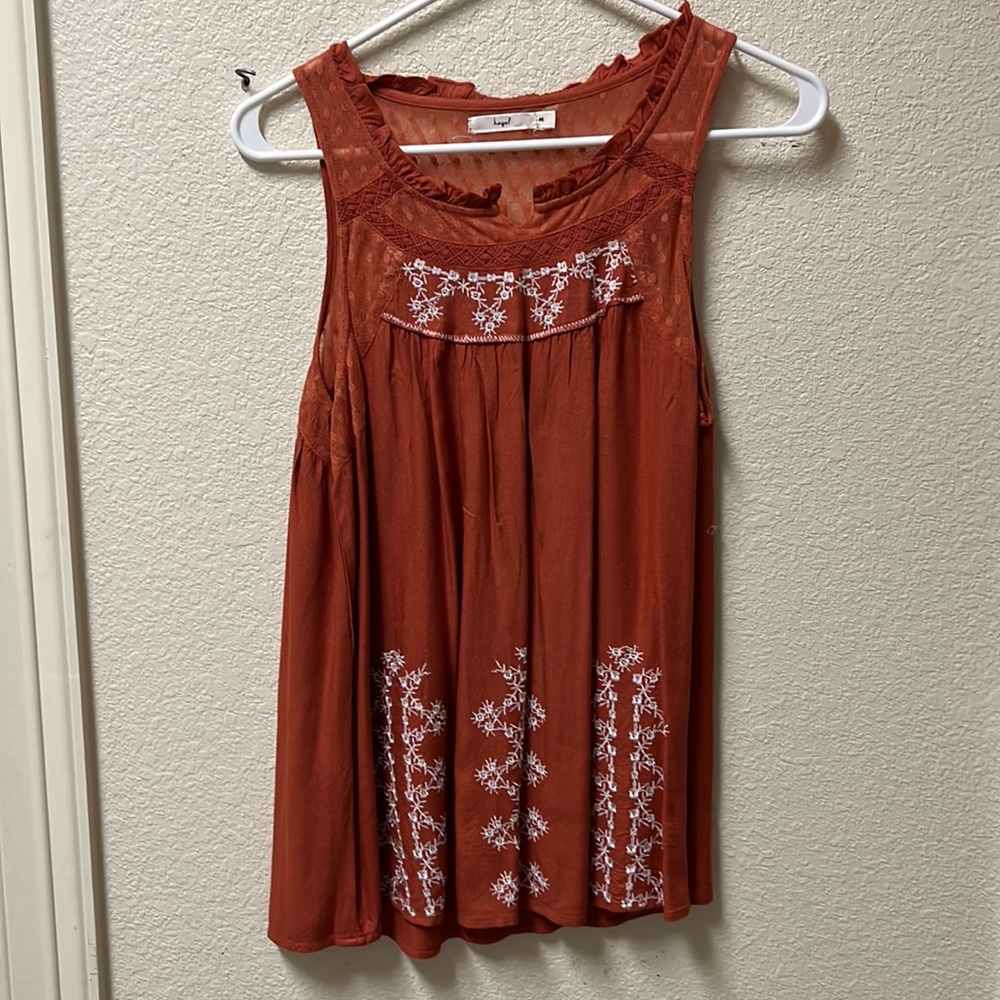 Woman’s orange tank top